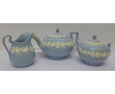 A three piece Wedgwood embossed Queen's Ware tea service