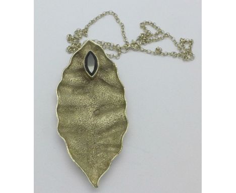 An Arts and Crafts style silver pendant and chain