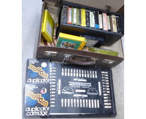 A case marked EIIR, 8 track cartridges including Kraftwerk, Beatles, Nazareth, Queen, etc. and an auto bridge playing board