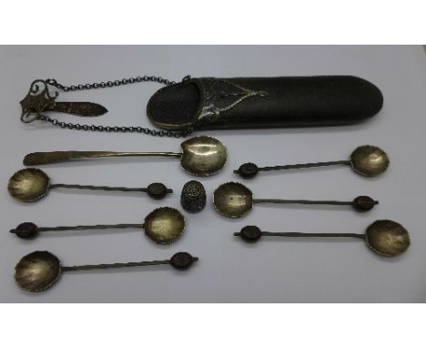 An Art Nouveau silver mounted spectacle case, a silver caddy scoop, six silver bean spoons and a silver thimble