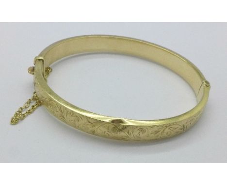 A 9ct gold bangle, a/f, (one dent), 11.3g