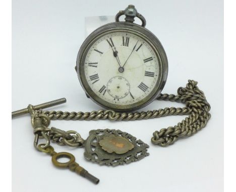 A silver cased pocket watch, fob and chain, dial a/f, lacking second hand