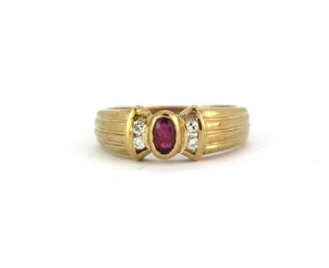 A 9ct yellow gold (stamped 9ct) ruby and diamond set ring, (L).