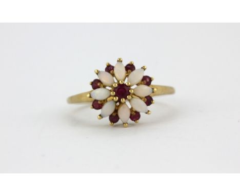 A 9ct yellow gold opal and ruby set cluster ring, (N.5).