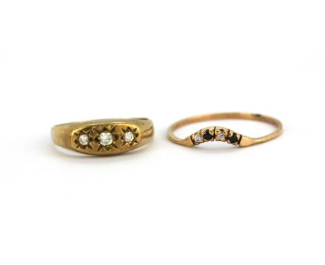 A 9ct yellow gold stone set ring together with a 9ct yellow gold stone set wishbone ring, (H &amp; N).