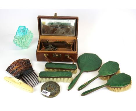A 1930's enamelled dressing table set with a ladies leather travelling case, perfume bottle, mantilla comb, nail buffer and c