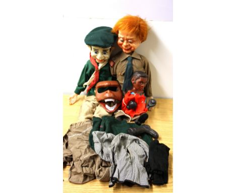 Two celluloid boy Scout ventriloquists dummies, H. 69cm, with a boxing puppet and monkey mask.