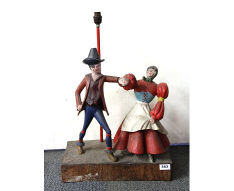 An unusual Black forest carved wooden figural lamp base, 41 x 25 x 62cm.