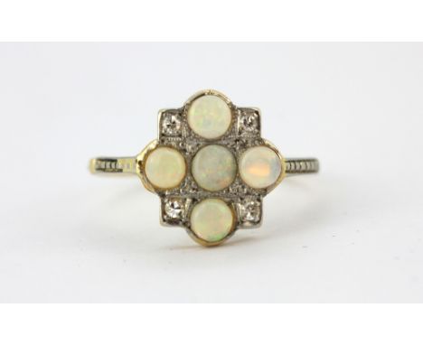 An early 20th century 18ct yellow gold and platinum ring set with cabochon cut opals and diamonds, (O).