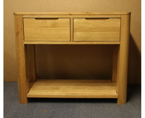 A contemporary light oak two drawer side table, W. 98cm, H. 80cm.