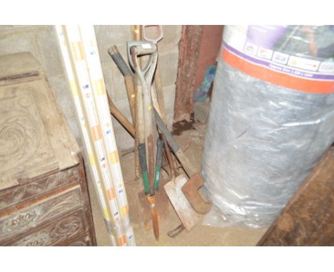 A quantity of long handled gardening tools