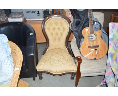 A Victorian mahogany spoon back nursing chair 
