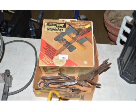 A box of various hand tools