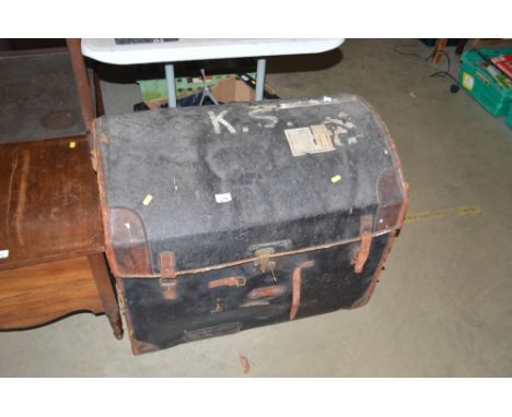 A leather bound dome topped trunk