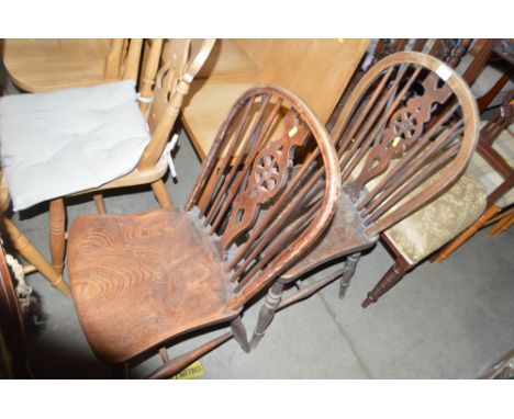 Two elm seated stick and wheel back kitchen chairs 