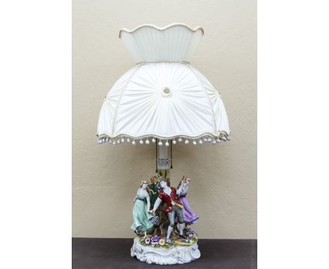 Dresden style porcelain figural group table lamp, the base modeled as a pair of peasant couples dancing around a tree, encrus