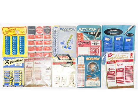 Group of vintage gramophone needle advertising displays with packets of needles.