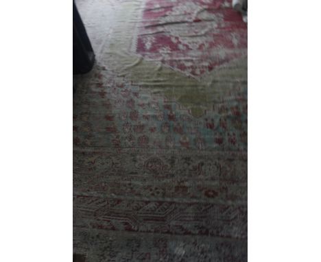 A LARGE KULA CARPET, Western Anatolia, 19th century, with a central hexagonal madder medallion containing geometric motifs an