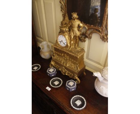 A NEO-ROCOCO GILT METAL MANTEL CLOCK with a white enamel dial and an eight day bell-striking movement, the case surmounted by