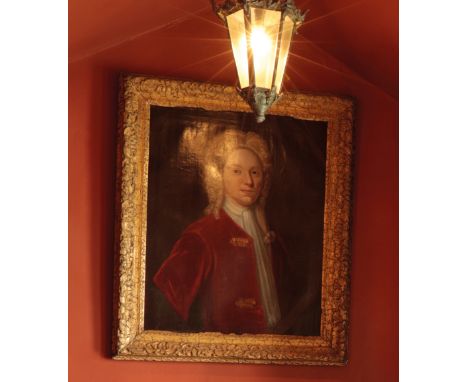 ENGLISH SCHOOL, 18th century A portrait of a young gentleman wearing a powdered wig, a white stock and a red-velvet jacket, i