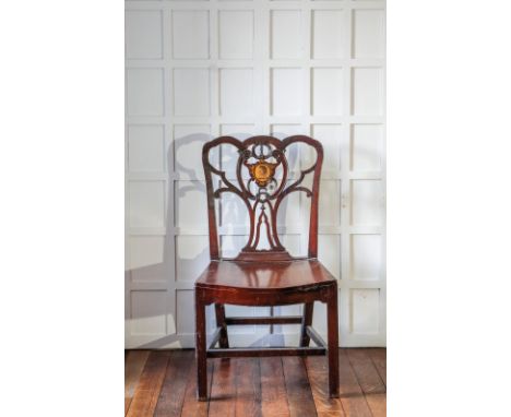 A PAIR OF EARLY GEORGE III MAHOGANY HALL CHAIRS in the manner of Thomas Chippendale, each with an intricately carved and pier