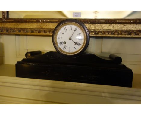 A VICTORIAN SLATE MANTEL CLOCK with a white enamel dial and an eight day movement, on a black slate plinth base with incised 