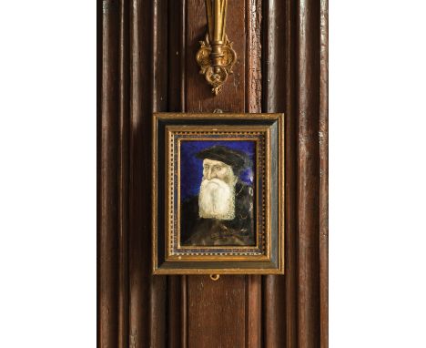 AN ENAMEL PORTRAIT PLAQUE in the manner of Leonard Limousin, painted with an elderly gentleman with a white beard wearing a d