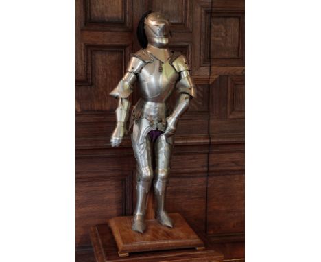 A MODEL SUIT OF ARMOUR in late medieval style, the helm with a feather plume, on a wooden plinth, 31.5" high