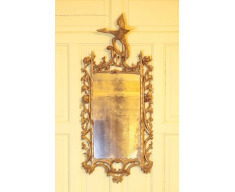 A GEORGE III GILTWOOD MIRROR of Chinese Chippendale design, apparently retaining the original rectangular plate in a frame ca