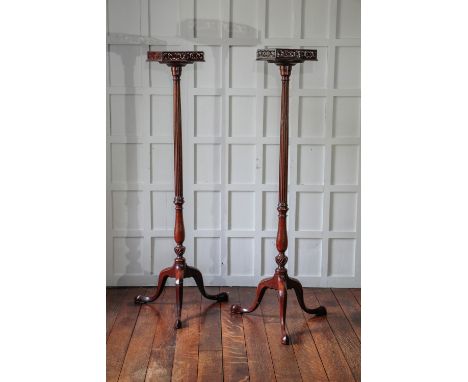 A PAIR OF EARLY GEORGE III MAHOGANY TORCHERES in the manner of Thomas Chippendale, each with an octagonal top with a pierced 