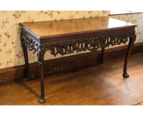 AN IMPORTANT GEORGE II IRISH MAHOGANY SIDE TABLE, the rectangular top with a bold gadrooned edge over a deep apron carved and