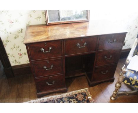 A GEORGE III MAHOGANY PEDESTAL DESK, the rectangular crossbanded top with radiating veneers and inlaid with chequered stringi