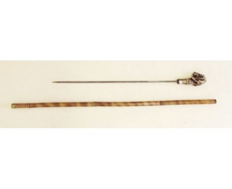 An early 20th century 'bamboo' sword stick with composition dogs head handle, chip to ear 