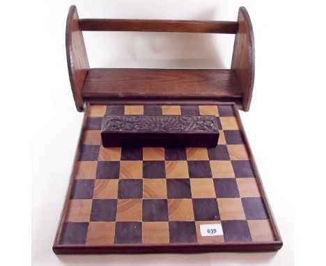 An oak book trough, marquetry chessboard and small carved box