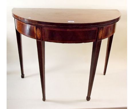 A George III mahogany inlaid fold top demi-lune card table