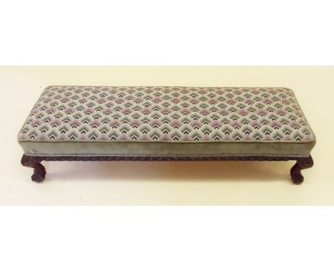 A long tapestry topped footstool 
