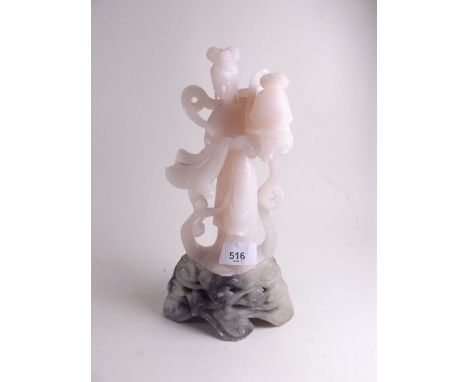 A Chinese jade/soapstone figure of a woman - 27cm 