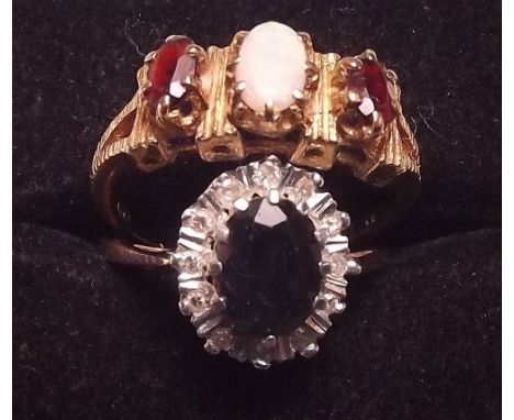 A 9 carat gold opal and ruby ring and a 9 carat gold sapphire and diamond cluster ring