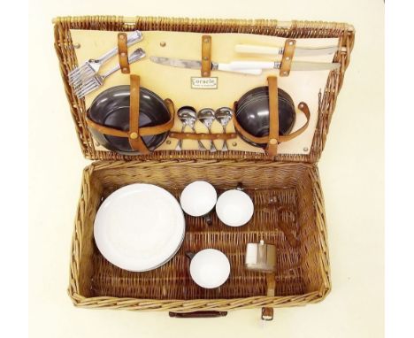 A 1950's Coracle picnic set in a wicker hamper with cheyney handle - not complete 