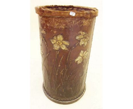 A leather stick stand with floral decoration 