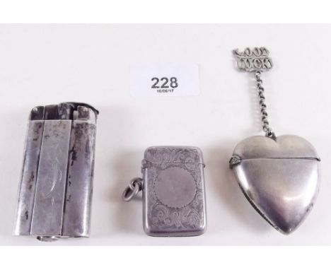 A silver lighter and two vesta cases