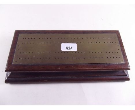 A brass and oak cribbage board and box 