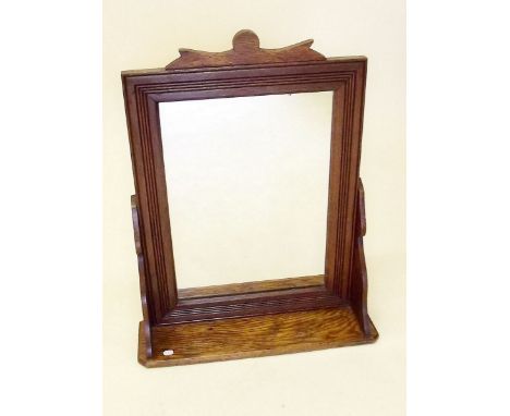 An oak framed wall mirror with shelf  - 21" x 15"