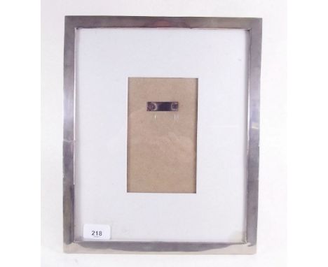 A large silver plated rectangular easel photograph frame (34 x 27.5cm external measurement)