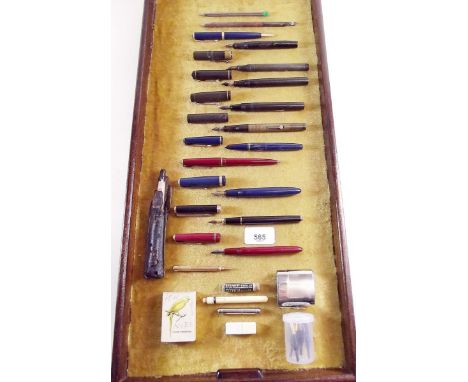 A quantity of old ink pens, dip pen, knibs and a travel inkwell 