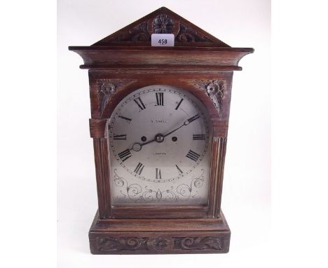 A mahogany cased mantel clock by Snell of London with silvered face and striking movement