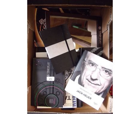 A box of Tag Heur and Chopard marketing and sales catalogues and Tag Heur mirror 