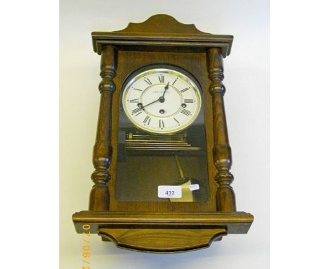 An oak cased wall clock by William Widdop 
