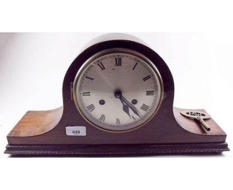 An oak cased mantel clock with striking movement