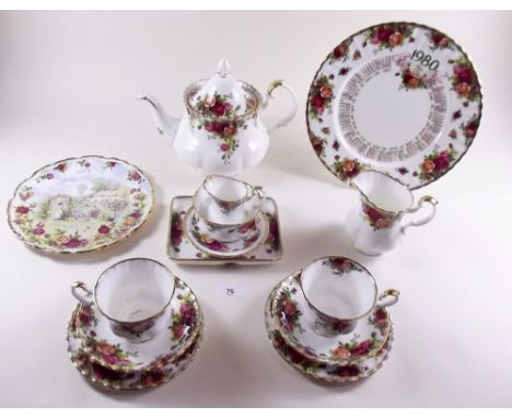 A Royal Albert Country Roses tea service comprising: teapot, six cups and saucers, milk, cream, sugar, rectangular dish and t